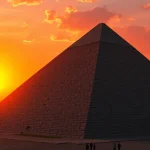 View of the Great Pyramid of Giza from https://piraminds.com/ illustrated at sunset with tourists.