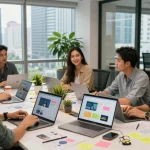 Creative team of web designers in Malaysia collaborating on a project