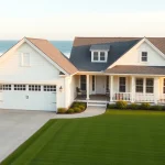 Enhance your Cape Cod home addition with a spacious attached garage design.