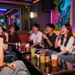 Exciting 제주유흥 karaoke night scene filled with laughter, neon lights, and friends enjoying drinks.